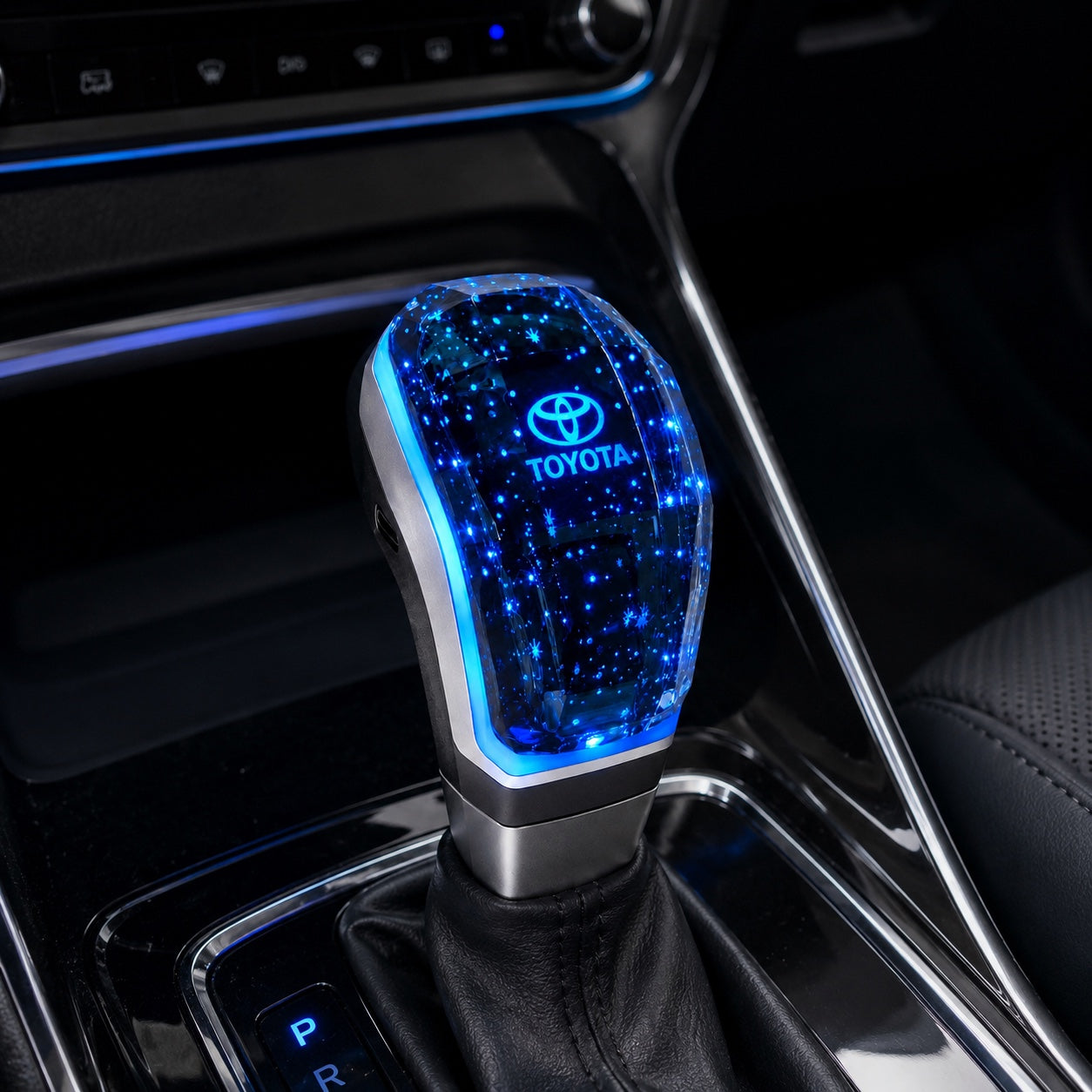 Crystal LED Toyota gear shift knob installed in a modern car interior with blue ambient lighting